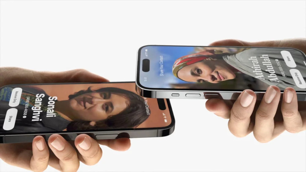Android copia AirDrop: Así podrás enviar archivos tocando dos móviles Dos teléfonos inteligentes intercambiando contactos a través de un toque, mostrando fotos de perfil y nombres.