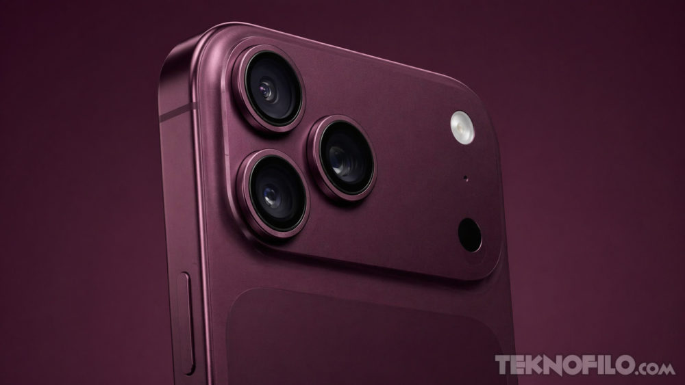 El iPhone 18 Pro podría llegar en color “Dark Cherry”, una mezcla de burdeos, café y púrpura intenso Cámara de un teléfono inteligente color burdeos con triple lente y flash LED en fondo oscuro.