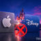 El ex CEO de Disney confirma conversaciones pasadas con Apple para una posible fusión Logos de Apple y Disney separados por una X roja frente a un castillo al atardecer, simbolizando desacuerdo.