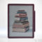 Tableta Kindle mostrando pila de libros de idiomas y diccionarios en su pantalla, con lápiz óptico al lado.