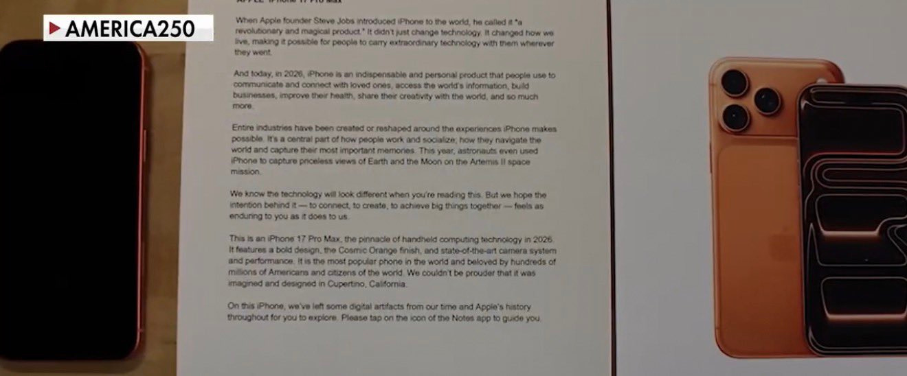 Texto del iPhone 17 Pro Max en una hoja junto a un dispositivo naranja destacado, marca Apple.