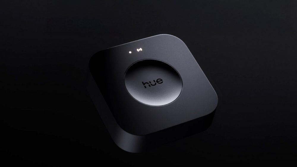 Dispositivo de control inteligente para Philips Hue en un diseño moderno y minimalista sobre fondo negro.