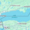 Mapa del lago Ontario con ciudades como Toronto y Niagara Falls destacadas, límites territoriales marcados.
