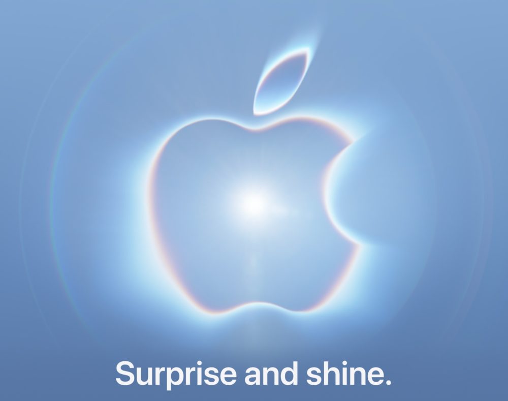 Logo luminoso de Apple sobre fondo azul claro con el texto Surprise and shine.