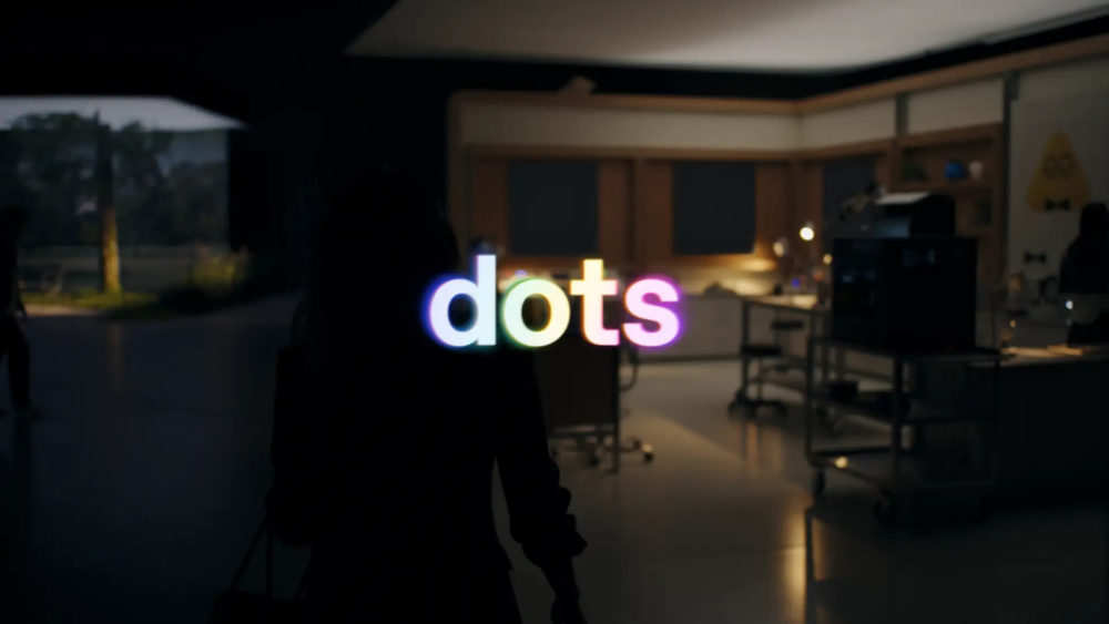 Texto luminoso dots sobre fondo oscuro, en un laboratorio moderno. ambiente de trabajo creativo e innovador.