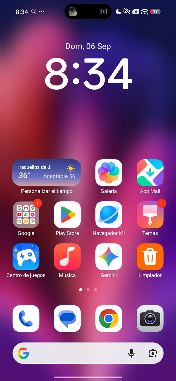 Pantalla de inicio de smartphone mostrando hora, apps y clima en fondo colorido.