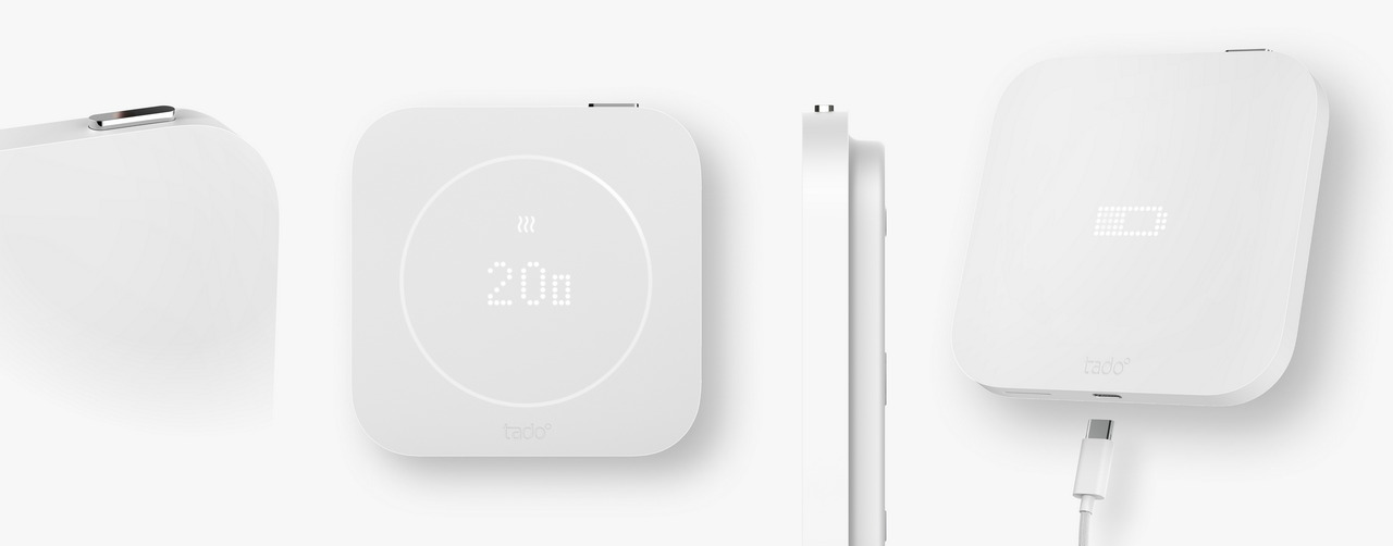 Termostato inteligente Tado en fondo blanco, muestra temperatura de 20 grados y está conectado por cable USB.